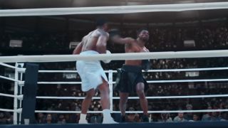 Jonathan Majors punching Michael B. Jordan in Creed III
