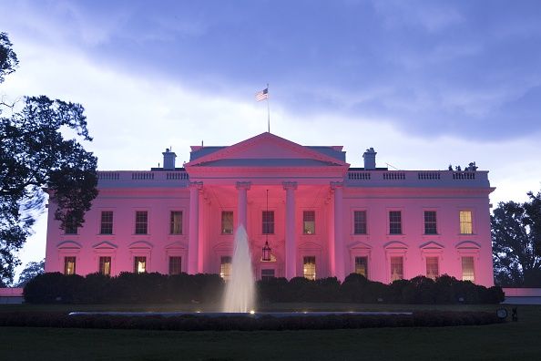 The White House lit by pink lighting for Breast Cancer Awareness Month in October.