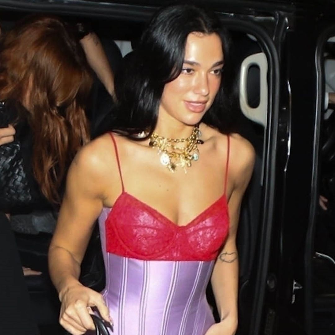 Dua Lipa was spotted in Brazil wearing a two-tone lacy corset, the dark denim trend, and a leopard-print Maison Margiela bag