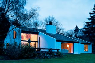 white rendered self build bungalow with double height rooms