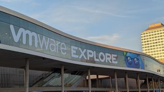 A photo of the outside of a conference centre with the words VMware Explore displayed on a sign