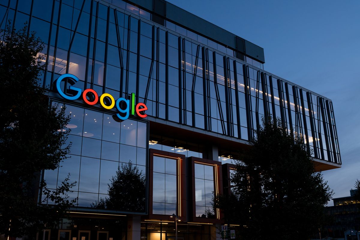 A view of the outside of Google&amp;#039;s Seattle office building at dusk