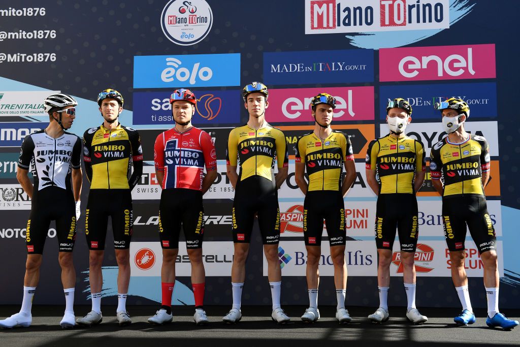 MILAN ITALY OCTOBER 06 Primoz Roglic of Slovenia George Bennett of New Zealand Tobias Foss of Norway Chris Harper of Australia Michel Hessmann of Germany Sepp Kuss of United States Sam Oomen of Netherlands and Team Jumbo Visma during the team presentation prior tothe 102nd MilanoTorino 2021 a 190km race from Magenta to Torino Superga 669m MilanoTorino on October 06 2021 in Milan Italy Photo by Tim de WaeleGetty Images