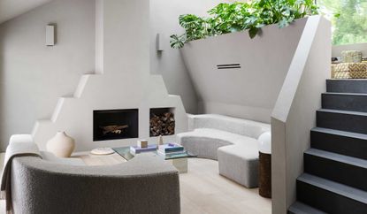 a seating area around a modern fireplace