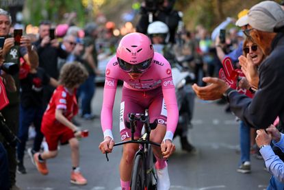 PERUGIA ITALY MAY 10 Tadej Pogacar of Slovenia and UAE Team Emirates Pink Leader Jersey sprints while fans cheers during the 107th Giro dItalia 2024 Stage 7 a 406km individual time trial stage from Foligno to Perugia 472m UCIWT on May 10 2024 in Perugia Italy Photo by Dario BelingheriGetty Images