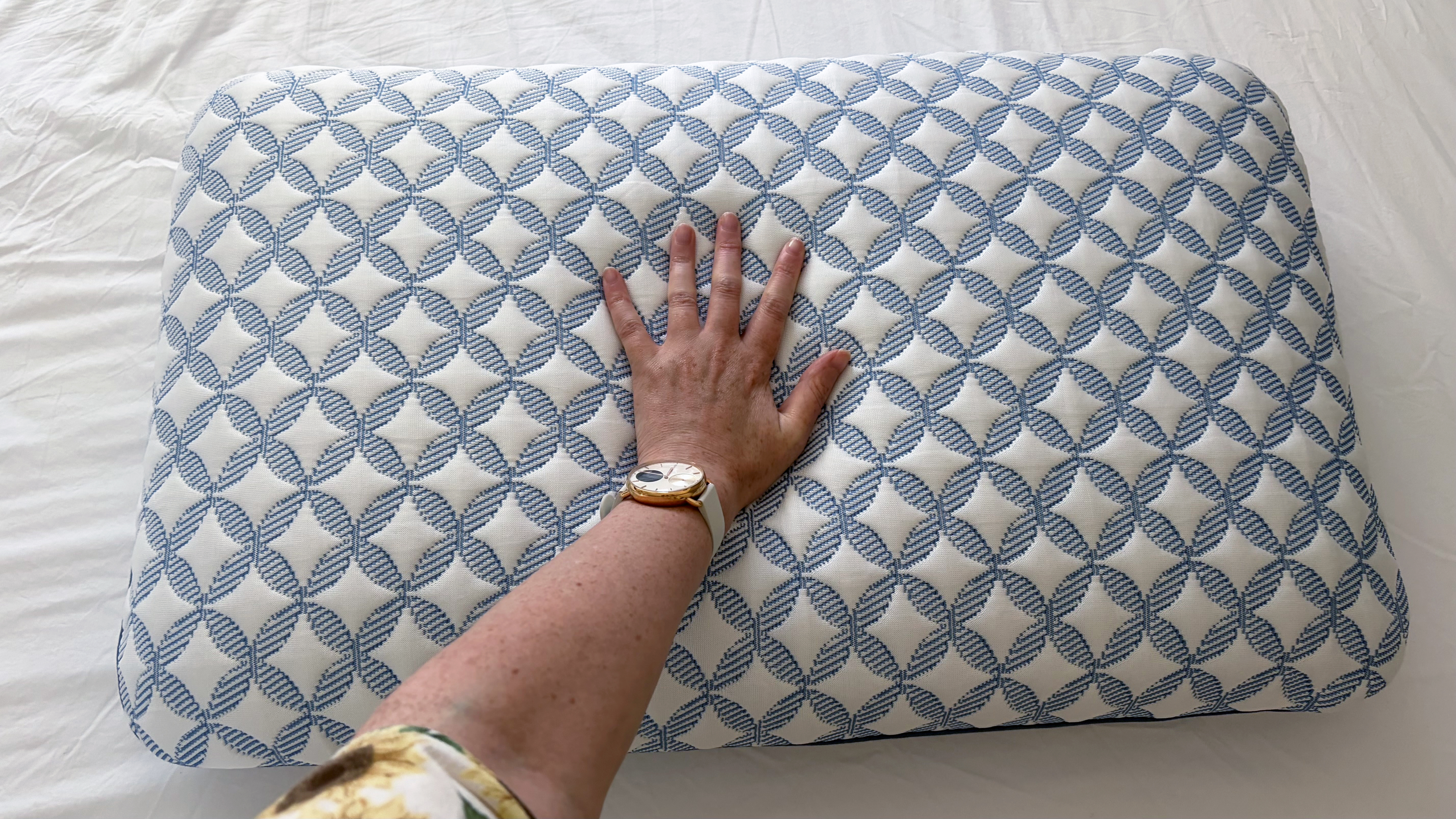 Tester Ruth Jones presses her hand into the GlacioTex cover of the Helix Cooling Memory Foam pillow