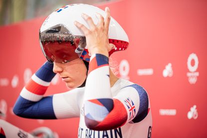 Elinor Barker adjusting her helmet