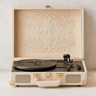 Crosley record player in cream leather with neutral floral pattern