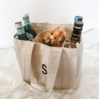 13. Monogrammed Initial Wine Bottle Tote: View at Etsy