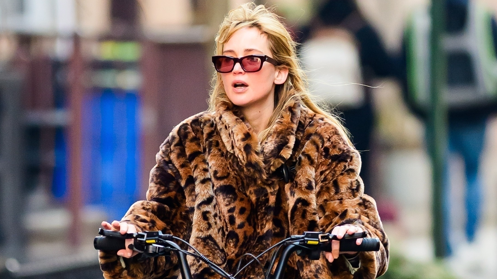Jennifer Lawrence was spotted on a bike ride in jeans, a leopard fur jacket, and black leather boots