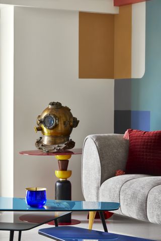 A living room with a color blocked wall