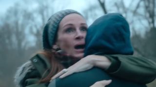 Julia Roberts looking relieved and she hugs someone in Ben Is Back