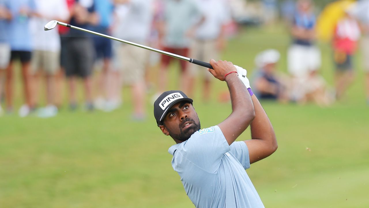 Sahith Theegala hits an iron shot at the 2024 Tour Championship