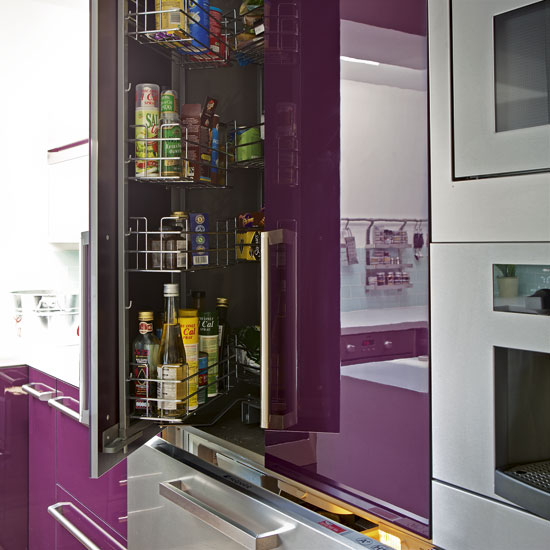 kitchen area with purple cupboard