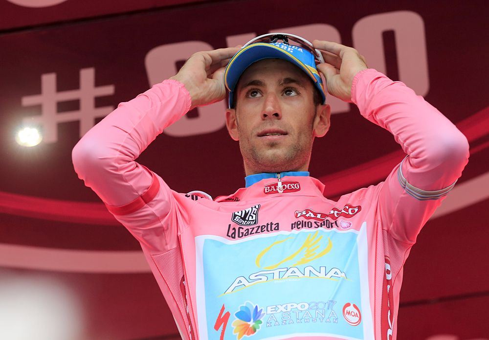 Italian Vincenzo Nibali celebrates on the podium the pink jersey after the 55,5kms eigth stage of the 96th Giro d'Italia time trial from Gabicce Mare to Saltara on May 11, 2013 in Saltara, Italy.