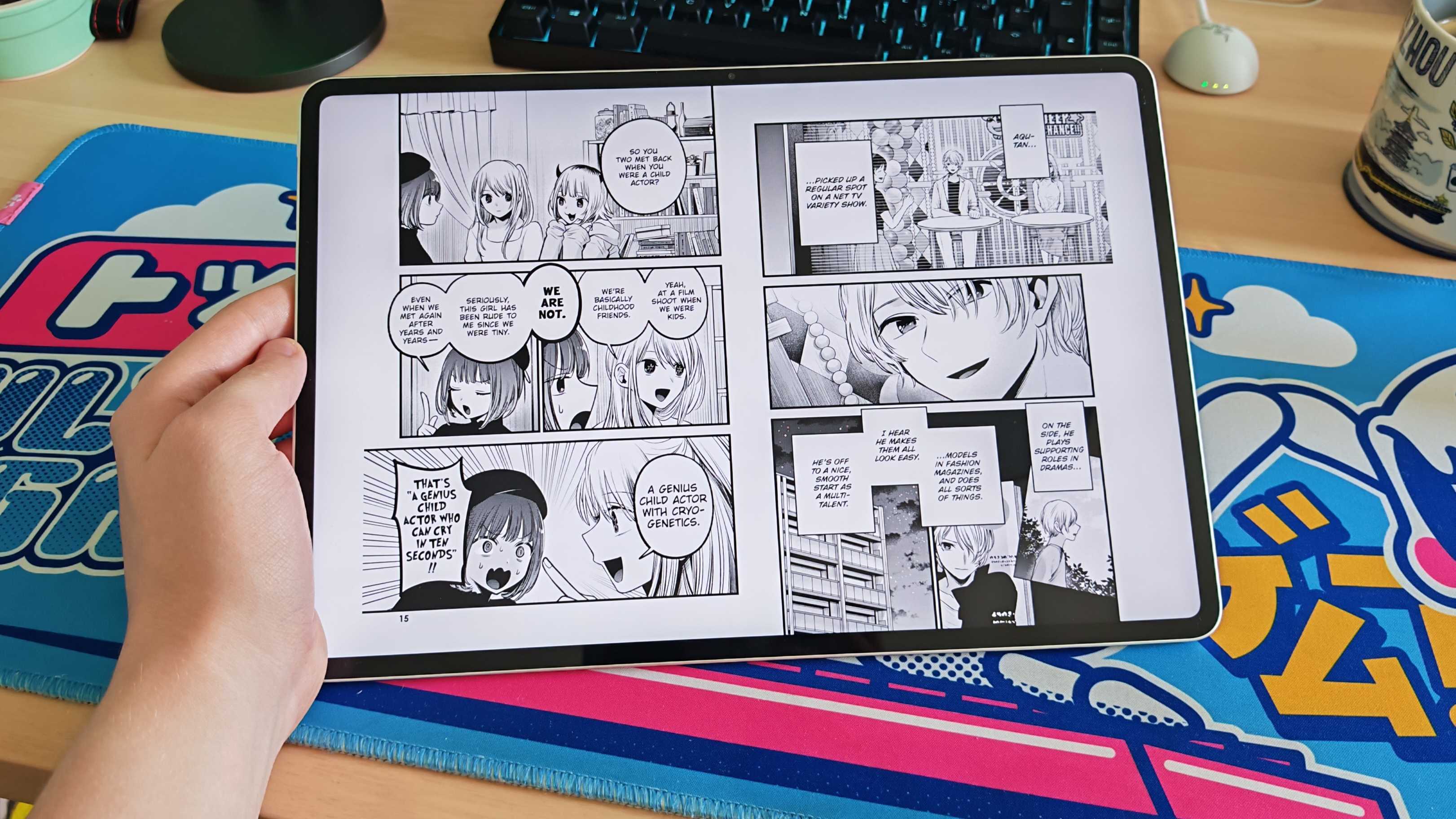 The Honor MagicPad 3 placed on a colorful desk mat.