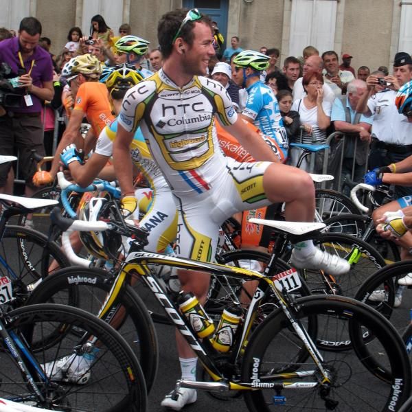 Mark Cavendish gets on his bike with a big smile
