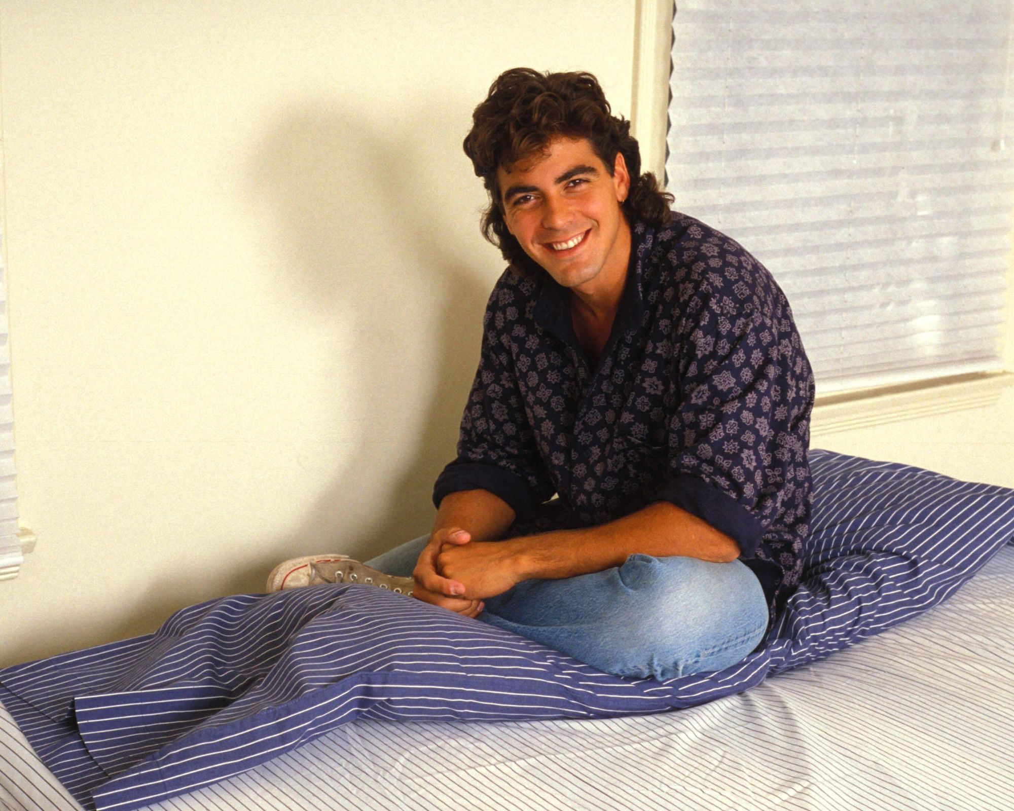 george clooney on his striped bed