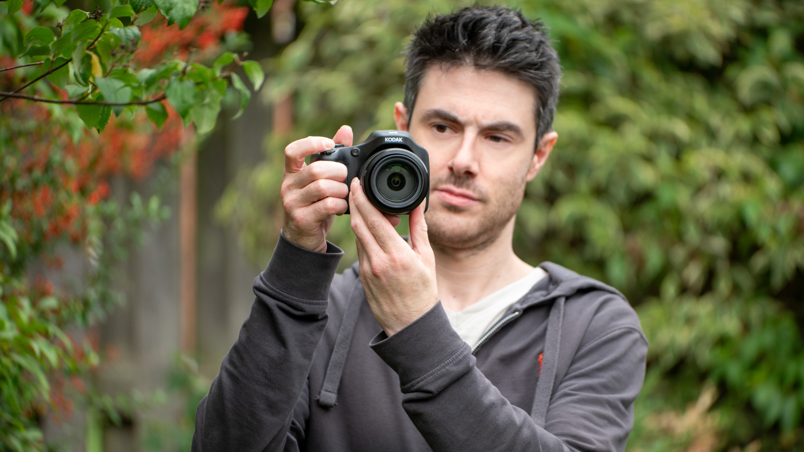 A man with the Kodak Pixpro AZ653 bridge camera