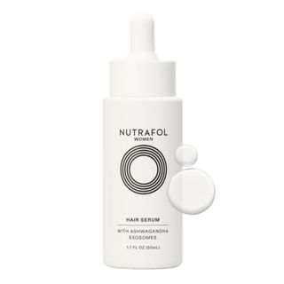 bottle of Nutrafol Women's Hair Serum on white background with two droplets
