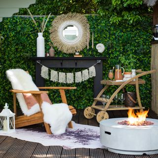 outdoor with fire pit in garden and relaxing chair with mirror