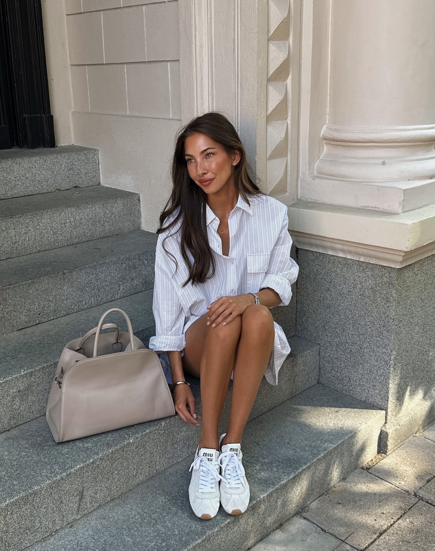 Woman in slim suede sneakers and a button-down