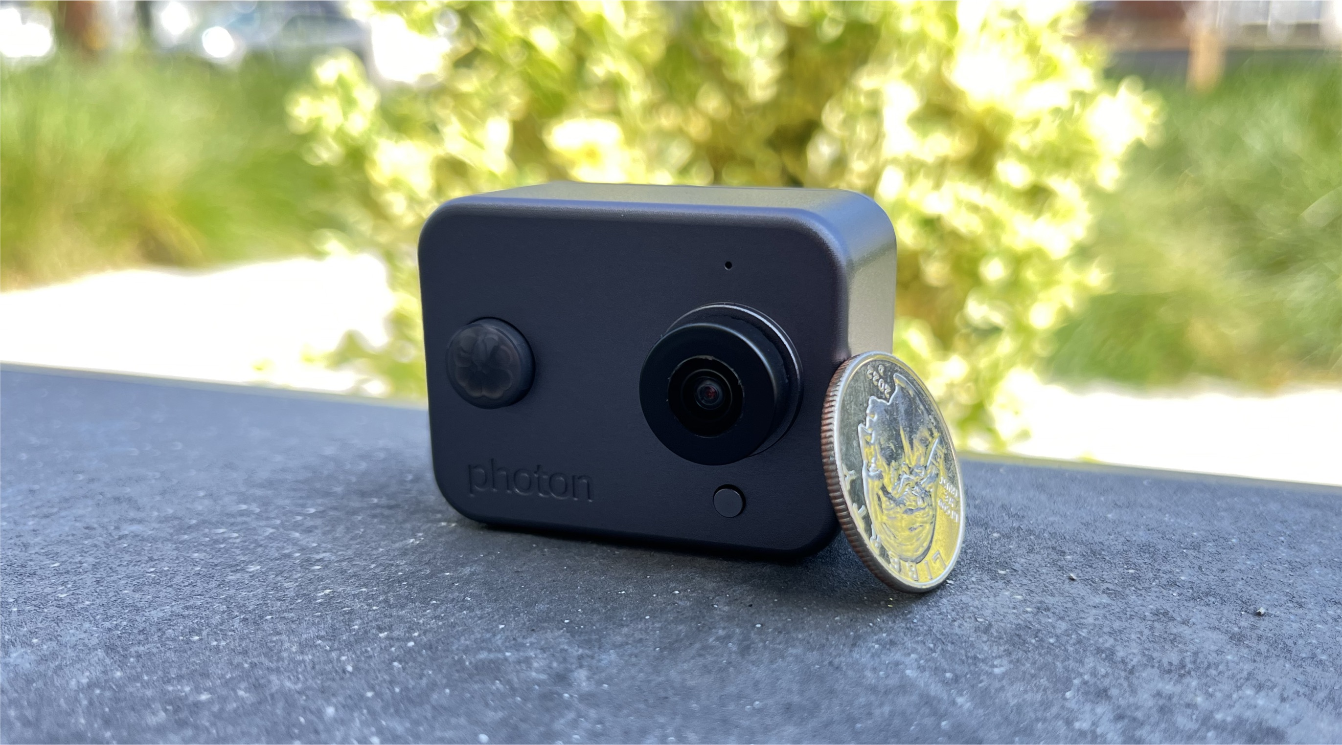 Toaster photon camera next to coin