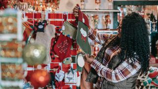 Last-minute Xmas shopper woman looks at stockings