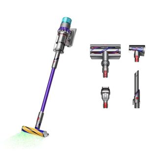 A purple and grey dyson vacuum cleaner, cordless. Four alternate vacuum heads beside it