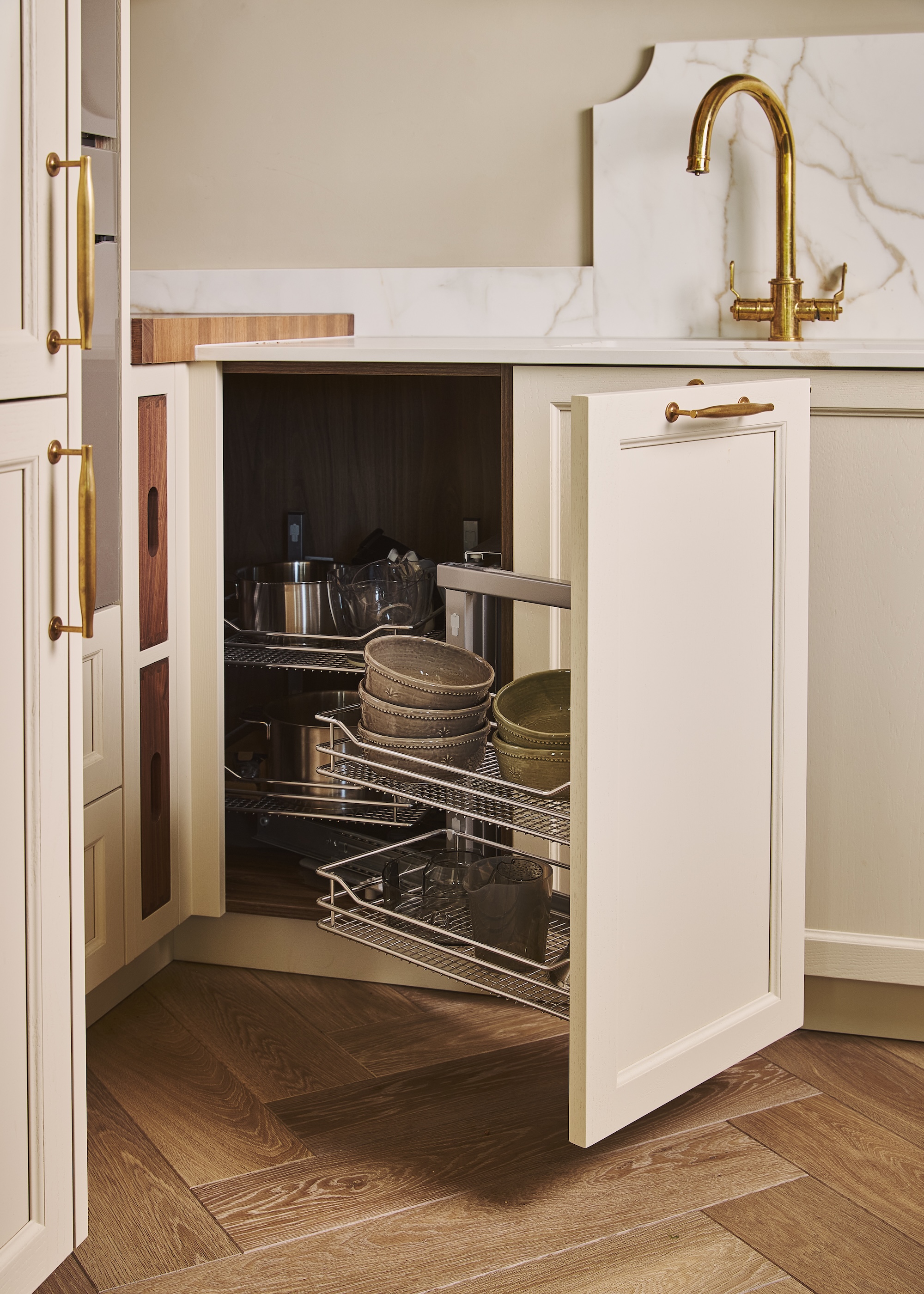 A corner kitchen cabinet showing a clever pull out racking system