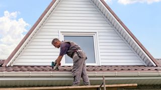 Man fixing a roof