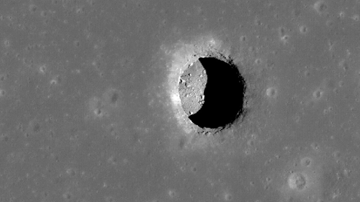 The shadow cast by a skylight into a lava tube beneath the moon's Mare Tranquillitatis suggests the feature may be a little more than 330 feet (100 meters) deep.