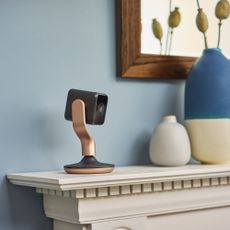 Hive smart home security camera on a sideboard