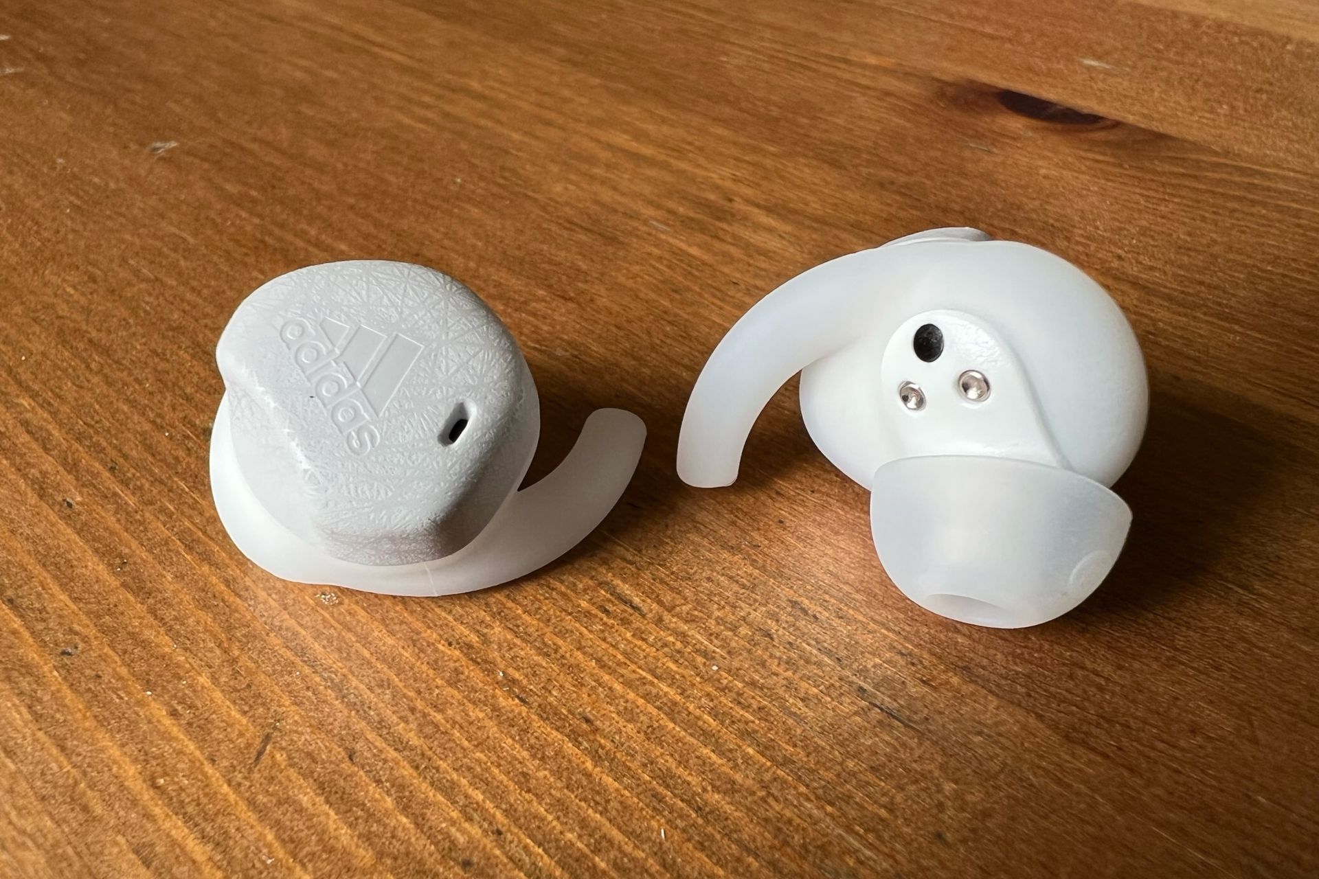 Adidas FWD-02 headphones in the image are shown from front on the left, and back on the right.