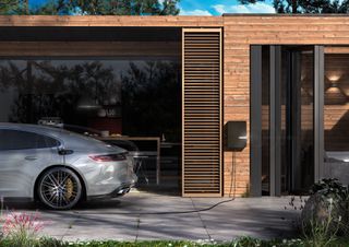 Electric car charging point on the outside of a house