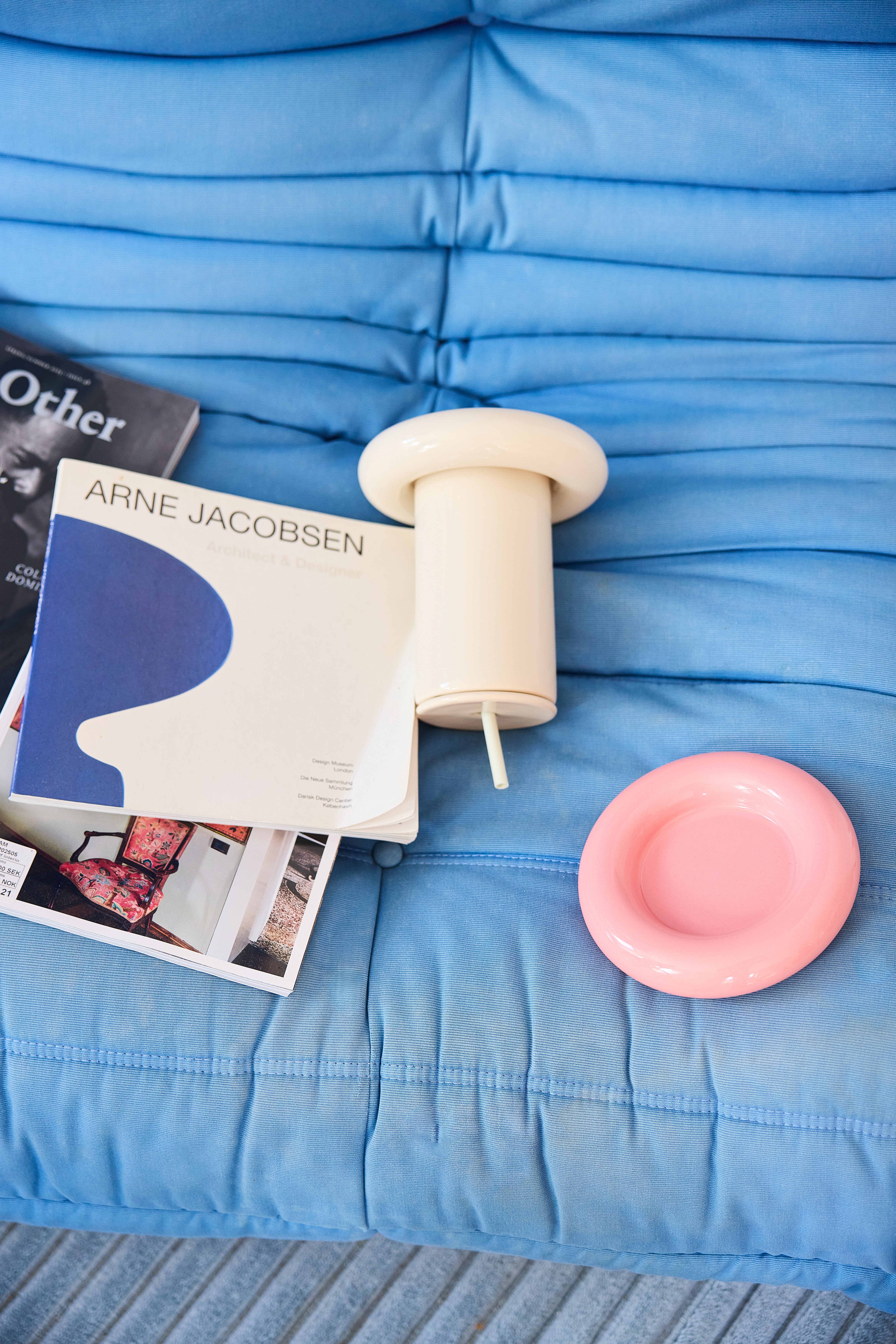 A series of whimsically shaped, pastel-shaded objects with a chunky feel sits in a Scandinavian studio flat with an irreverent atmosphere.