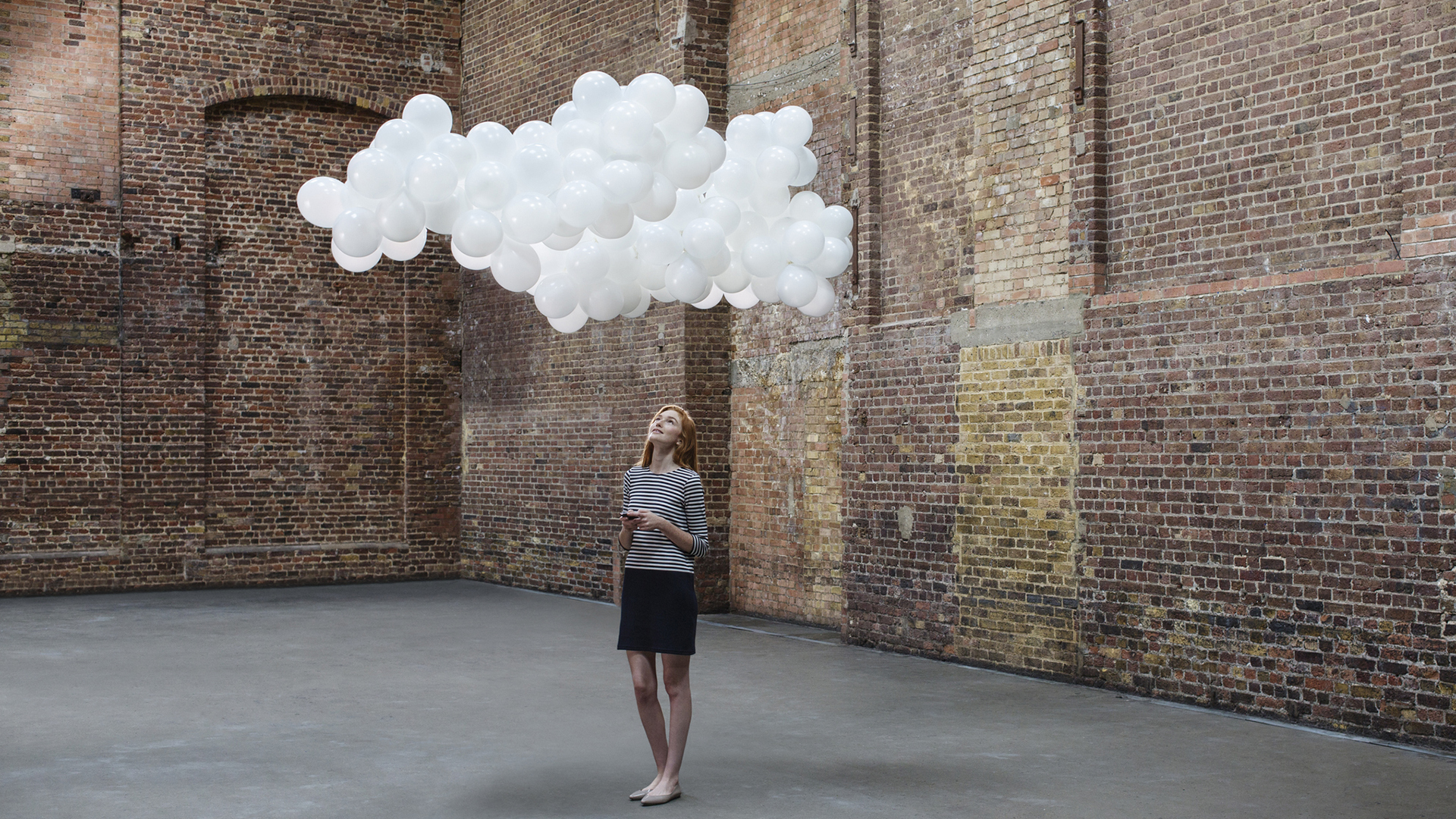 woman stood under a cloud