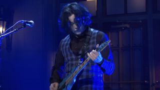 Jack White covered in blur playing guitar on SNL