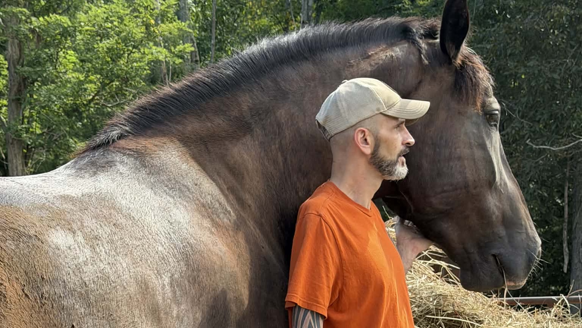 Adam Watson standing with a horse