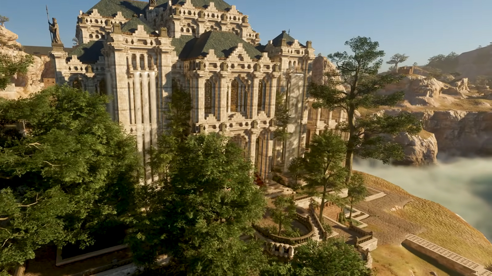 A castle overlooking a foggy ravine