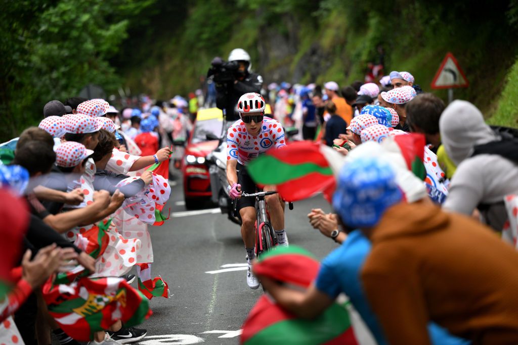 SAN SBASTIN SPAIN JULY 02 Neilson Powless of The United States and Team EF EducationEasyPost competes in the breakaway at the Cote dAlkiza 365m while fans cheer during the stage two of the 110th Tour de France 2023 a 2089km stage from VitoriaGasteiz to San Sbastin UCIWT on July 02 2023 in San Sbastin Spain Photo by David RamosGetty Images