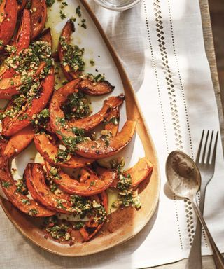 pumpkin slices baked with herbs on a dish