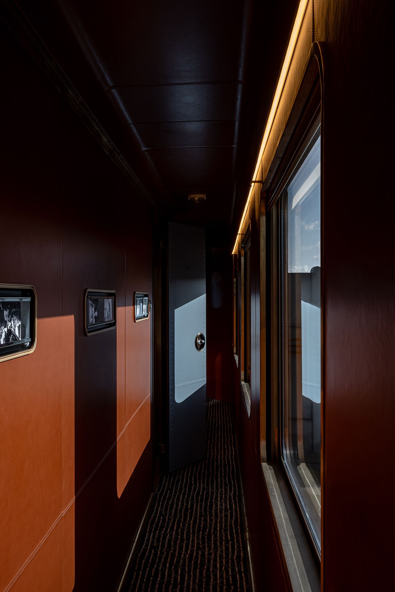 A 1980s-inspired luxury train features sleek decor.