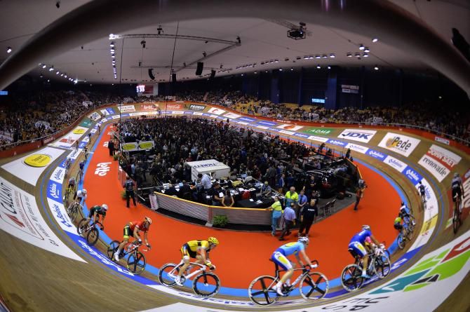 The riders up high on the banking