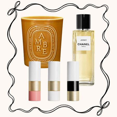 A collage with a candle, perfume and lipsticks with a ribbon illustration around the outside