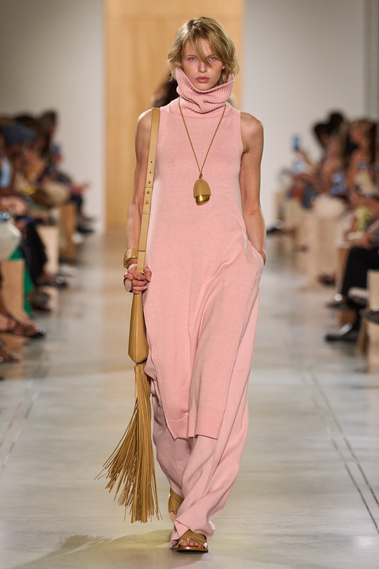 A model wore Elle Fanning&#039;s dress-over-pants look on the Michael Kors Spring 2026 runway