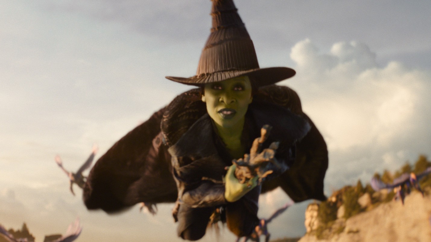 Cynthia Erivo as Elphaba flying on a broom in Wicked: For Good