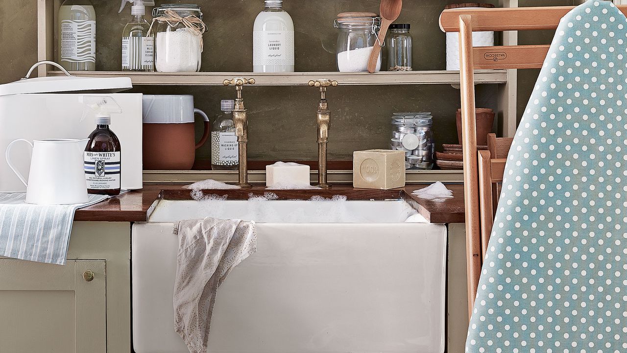 laundry room butlers sink with shelves and ironing board