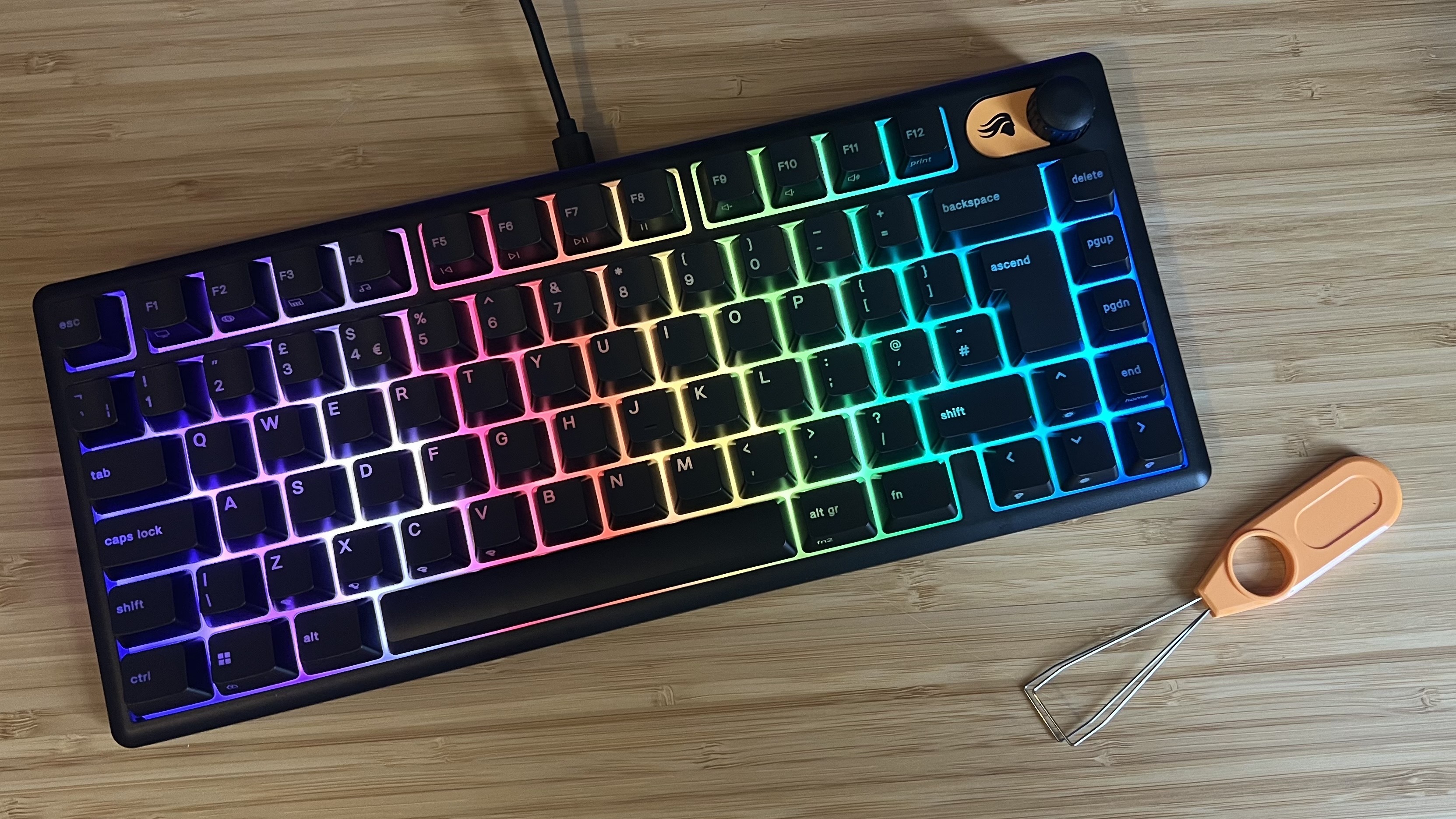 Glorious GMBK 75% gaming keyboard on wooden desk