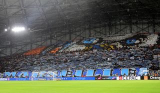 Marseille fans with a tifo ahead of a game against PSG in March 2024.